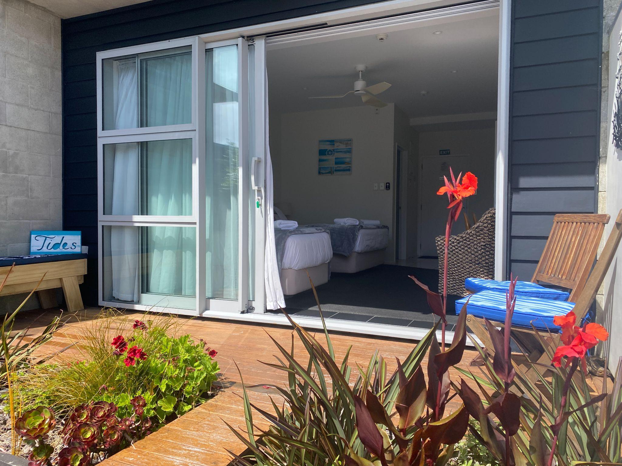 Back patio with outdoor furniture and garden