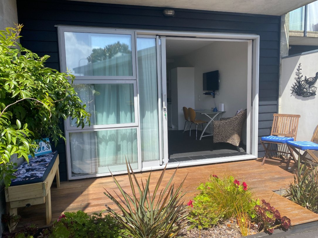 Front patio with sliding doors open into the Tides at Carters studio